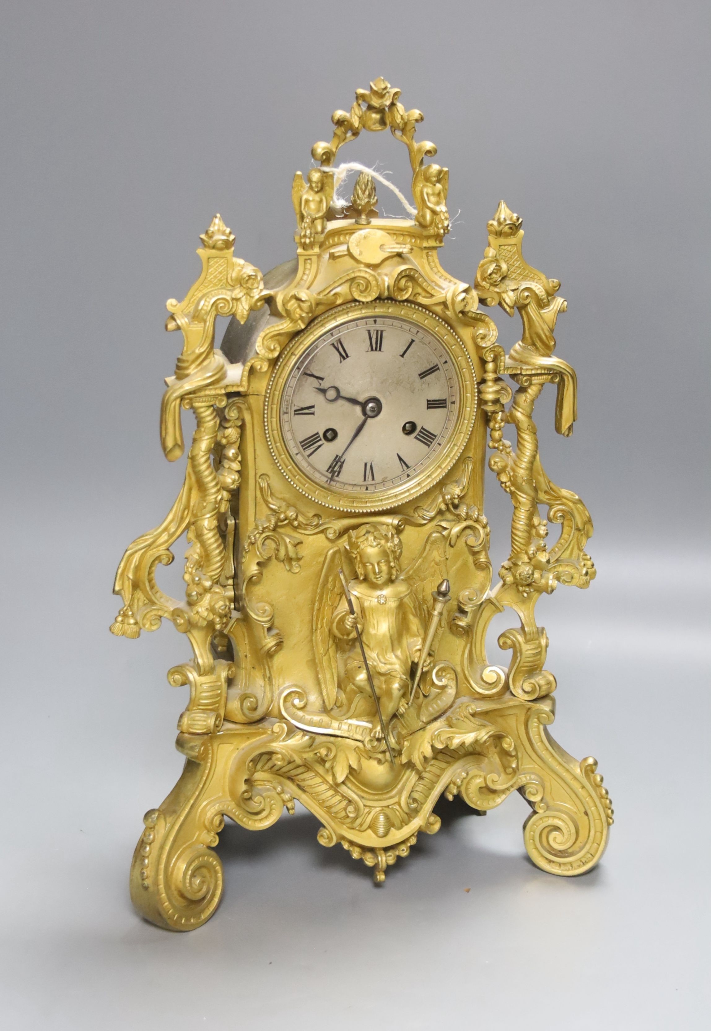 A 19th century French ormolu mantel clock, mounted with an angel, 39cm